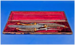 Late Victorian Horn Handled Carving Set, in a crimson satin lined case.