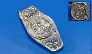 A Useful Mexican Silver Money Clip set to the centre with a silver coin. Marked `Sterling Mexico`