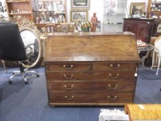 George III Mahogany Bureau, circa 1770, the fall front opening to reveal central door, flanked by