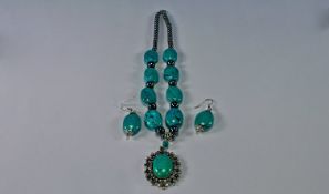 Turquoise and Hematite Pendant Necklace and Earrings, the necklace comprising smooth oval beads of