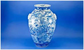 Large Japanese Blue and White Ovoid Vase, hand painted with opposing versions of the same garden