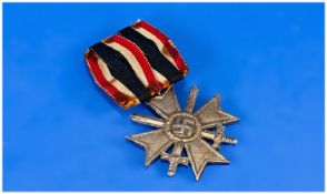 Third Reich War Merit Cross second class with original ribbon.  Features swords and marked 1939 on