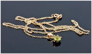 9ct Gold Green Coloured Stone Pendant, Suspended On A 9ct Gold Fine Link Chain, With Box.