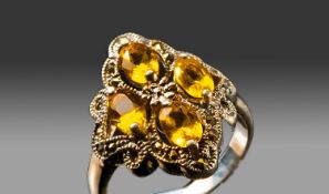Silver Dress Ring Set With Four Faceted Citrines Surrounded By Marcasites,