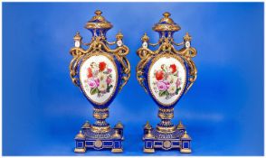 Pair of Large Sevres Style `Bleu Royale` Snake Handled Vases, each ovoid body decorated to back and