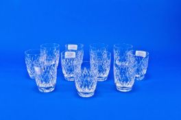 Waterford Set of Eleven Cut Glass Tumblers, all with diamond cut bodies and star cut bases, 3½