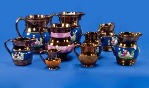 Collection of 9 Staffordshire Copper Lustre Jugs, various sizes.