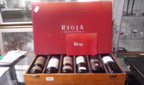 Collection of 6 Bottles of Spanish Rioja (Red Wine): in a wooden crate.