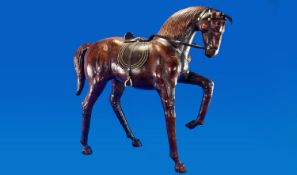 Leather Figure of a Prancing Horse with leather saddle and reigns. 24.5 inches in height.