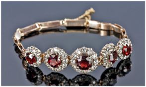 Edwardian 9ct Gold Set Garnet Ladies Bracelet with safety chain. The five garnets surrounded by