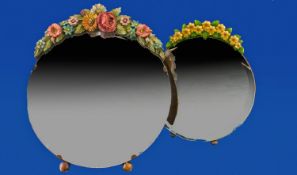 Two Edwardian Vanity Mirrors, circular with bevelled glass and fruit motifs. (one for wall hanging,