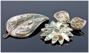 Collection of Costume Jewellery including a pair of earrings, a leaf shaped brooch and flower