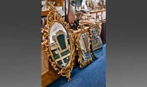 Three Rococo Style Gilt Framed Mirrors, together with a circular wall mirror, faceted edging, all