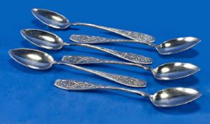 A Set Of Six Japanese Teaspoons. Decorated to the front of the handle in relief with an exotic bird