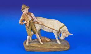 Royal Dux Fine Figure Group, A Young Boy Leading A Bull Calf Circa 1900. Pink triangle to base. 11.