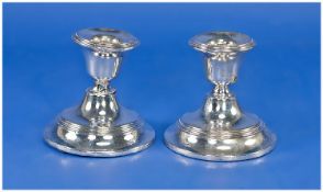 Pair of Silver Squat Candlesticks, hallmarked Birmingham 1919, each 3.5 inches high (a/f to one)