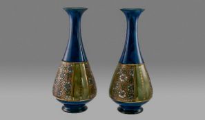 Royal Doulton Pair Of Vases, Circa 1928 with incised decoration on blue ground. Signed Florrie