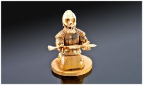 Ivory and Wooden Skeleton Samurai Netsuke.