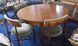 G Plan Teak Veneered Dining Suite, the table of circular form and raised on square tapering legs,