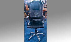 A Modern Office Chair black and chrome with pneumatic seat on five castors