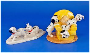 Royal Doulton 101 Dalmation Series. 1. Large Size Pups in Armchair 2. Lucky and Freckles on Ice.