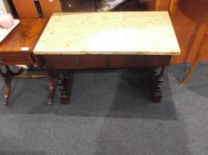 Small Mahogany Low Table, with marble like top, fitted with two drawers, raised on spindle