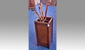 Early 20th Century Oak Stick Stand, of square form, the uprights with finial terminals, the stand