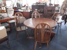 Ercol Elm Topped Dining Table and Four Chairs, circa 1980, the table of extending form, the legs of
