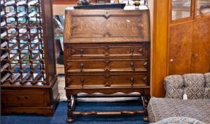 Early 20th Century Carolean Style Oak Bureau, the fall front with geometrically applied mouldings,
