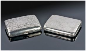 Silver Cigarette Case, the front and back decorated with scroll-work, with a vacant cartouche to