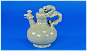 A Small Chinese Cadogan - type Celadon Glaze Ewer, with moulded leaf and scroll decoration and