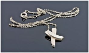 Paloma Picasso For Tiffany & Co. A Designer Silver Pendant In A Crossed Ribbon Design & On A