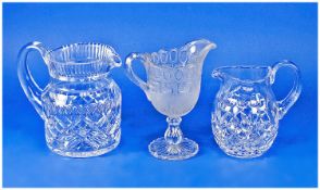 Two Cut Glass Jugs, together with a pressed glass pedestal jug, probably Victorian.