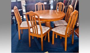 Contemporary Beech Framed Dining Table and Six Chairs, the circular table of pedestal form and