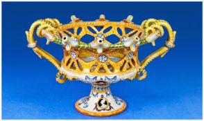 Italian Majolica 19th Century Openwork Painted Pedestal Bowl, hand painted with a scene of a Putto