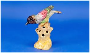 Clarice Cliff Handpainted Bird Figure, perched on a tree stump. 6.75 inches high