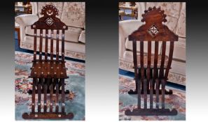A Fine Quality Antique Middle Eastern Arabesque Carved and Inlaid Chair of unusual form in walnut