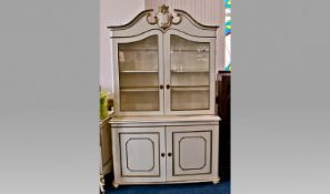 Large French Style White Painted Bookcase, the upper half with a cartouche finial to pediment,