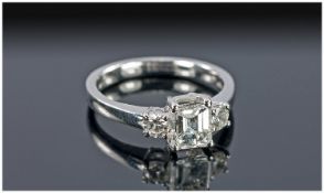 18ct White Gold Diamond Ring, Set With An Emerald Cut Diamond, In A Four Claw Setting Between Two