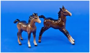 Two Beswick Foal Figures, one larger, stretched, first version, in brown gloss, 5 inches high, one