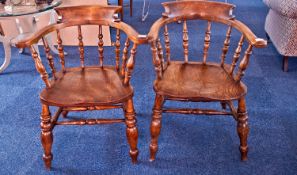 Pair of Elm and Beech Smokers Bow Armchairs, with curved back supports, baluster and ring turned