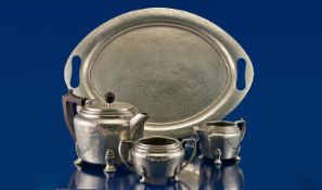 Four Piece Pewter Tea Service, comprising teapot, milk jug and sugar bowl, complete with a matching