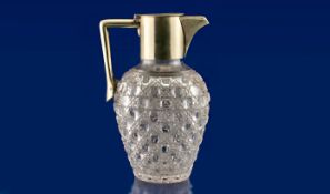 Cut Glass Claret Jug with hard metal mounts. 8.5 inches high.