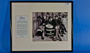 A Signed Framed Photograph of the Rolling Stones at the Chelsea Potter Pub, Kings Rd, London.