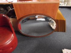 Early 20th Century Oak Framed Mirror, of oval form, fitted with bevelled edge glass.