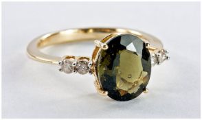 9ct Gold Diamond Dress Ring, Set With An Oval Faceted Green Stone Set Between Four Round Cut