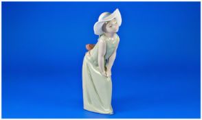 Lladro Figure `Curious` Model Number 5009. Issued 1978. 9`` in height. With original box & papers.