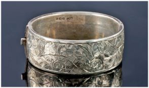 Silver Hinged Broad Bangle. The Front With Floral Engraved Decoration,  Fully Hallmarked For