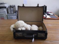 Stuffed Poodle Pyjama Case in WWII refugee suitcase, recumbent poodle unzips to the back and has