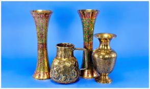 Four Pieces of Islamic Brassware comprising one jug with Arabic script embossed to the neck and
